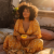 zusik78_A_beautiful_confident_curvy_woman_sitting_on_a_sunlit_f52cec55-9ac0-4df3-b74a-c43bdb2fe024_0.png